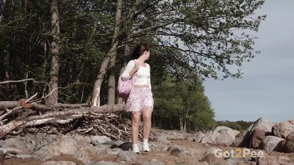 Girl next door type Rita gets caught taking a piss on boulders at the beach  - Public, Pissing, Beautiful, Solo, Hairy, Upskirt, Babe, European, Outdoor, Spreading  - Photo 1