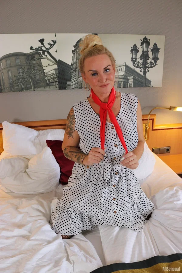 Tattooed blonde Frida looses one of her large breasts from a black brassiere  - Piercing, MILF, Big Tits, Lingerie, Tattoo, Amateur, Stockings, Pigtails, Upskirt, Clothed  - Photo 1