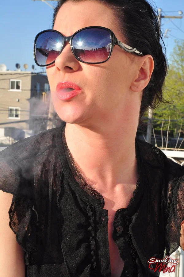 Fully clothed brunette woman smokes and drinks on patio in sunglasses  - Smoking, Non Nude, Fetish, Glasses, Brunette  - Photo 11