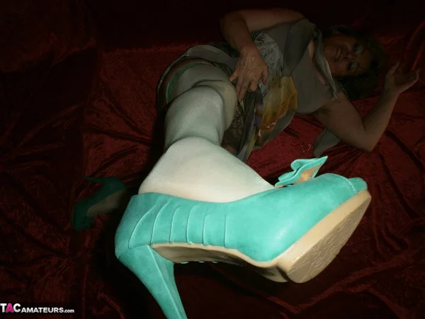 Chubby mature granny Caro in green stockings flashes lace panty cameltoe  - Granny, BBW, Amateur, Stockings, Panties, Big Tits, High Heels, Curvy, Chubby, Thick  - Photo 12