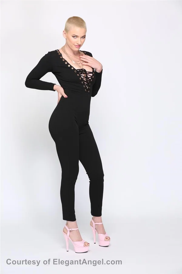 Blonde Riley Nixon poses in her tight black outfit & unveils her big tits  - Short Hair, Teen, Canadian, White, Natural Tits, Clothed, Pornstar, Big Tits, Beautiful, Blonde  - Photo 5
