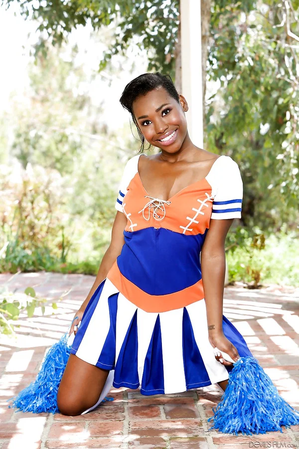 Ebony girl Ashton Devine lifts cheerleader skirt to flash naked twat on patio  - Cheerleader, Ebony, Skirt, Outdoor, Spreading, Babe, Teen, Big Tits, Socks, Black  - Photo 4