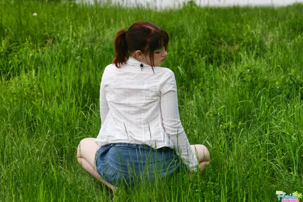Amateur girl with red hair Barbie A exposes her tits while in a grassy field  - Amateur, Outdoor, Redhead, Clothed, Pigtails, Legs, Skirt, Big Tits, Upskirt, Tattoo  - Photo 10