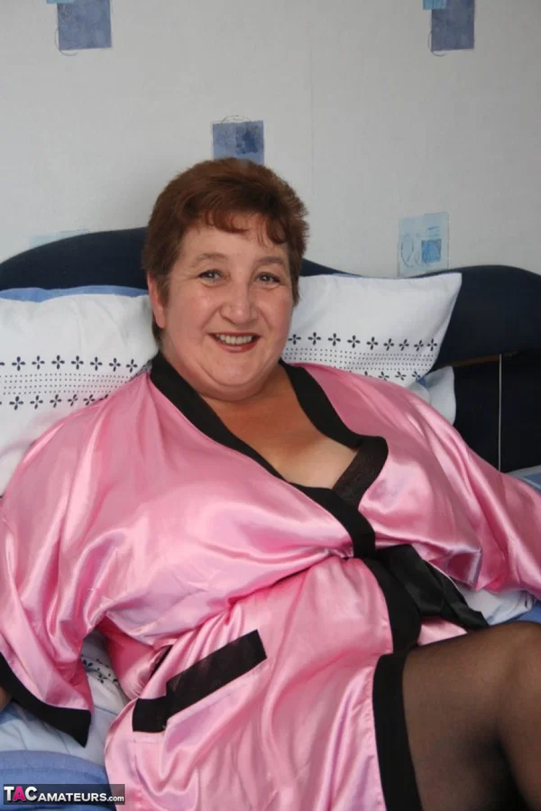 Mature fatty Kinky Carol looses her huge breasts from a satin robe and bra  - Mature, Close Up, Chubby, BBW, Lingerie, Amateur, Curvy, Thick, Short Hair, Stockings  - Photo 1