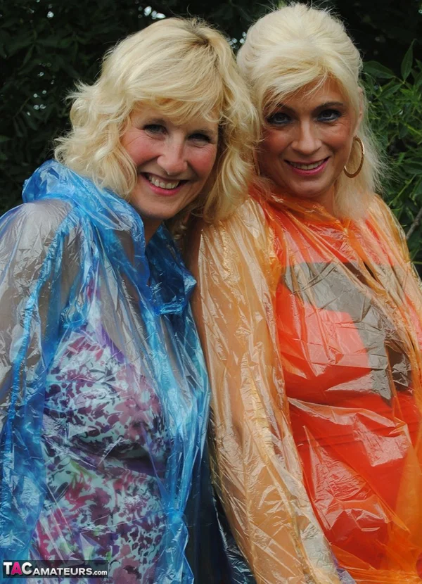 Mature lesbian Dimonty and GF cover their naked bodies in see thru raincoats  - Mature, Latex, Outdoor, Lesbian, Clothed, Skirt, Blonde, Humping, MILF, European  - Photo 8