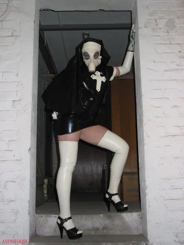 Solo model Avengelique sports a gas mask while wearing latex Nun clothing  - Nun, Latex, Skirt, Fetish, Uniform, Stockings, Clothed, High Heels, PAWG, Legs  - Photo 1