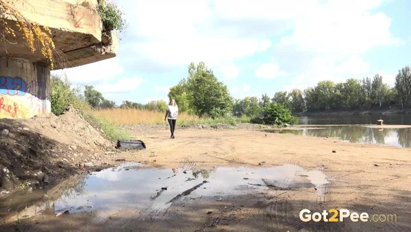 Blonde chick Barbe pulls down black leggings for a pee on a country road  - Pissing, Outdoor, Babe, Clothed, Beautiful, Ass, Undressing, PAWG, Solo  - Photo 1