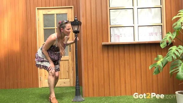 Blonde woman Nicol D hikes short dress to pee standing behind the house  - Public, Pissing, Hairy, Spreading, Legs, Babe, Upskirt, Close Up, Skirt, Clothed  - Photo 1