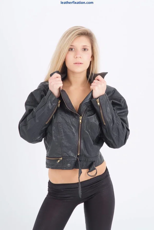 Blond chick unzips her leather jacket in a black bra and leggings  - Yoga Pants, Clothed, Boots, Babe, Face, Blonde, Lingerie, Solo, Leather, Ass  - Photo 2