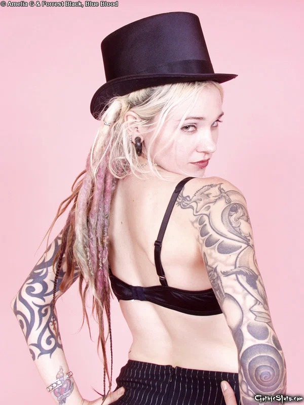 Tattooed blonde Voltaire Blue doffs a top hat while getting naked in heels  - Tattoo, Fetish, Upskirt, Skirt, High Heels, Ass, PAWG, Panties, Tiny Tits, Babe  - Photo 3