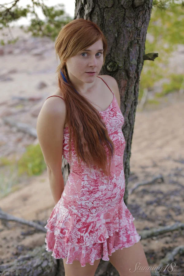 Young redhead strips naked in the outdoors against a tree on sandy ground  - Redhead, Teen, Outdoor, Tiny Tits, Beautiful, Clothed, Panties, Babe, Glamour, Skinny  - Photo 1