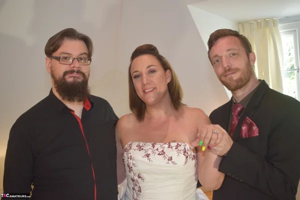 Amateur woman Sara Banks as her tits and pussy freed from a gown by two men  - Wedding, Reality, Curvy, Mature, Chubby, BBW, Thick, Threesome, Clothed, Upskirt  - Photo 1