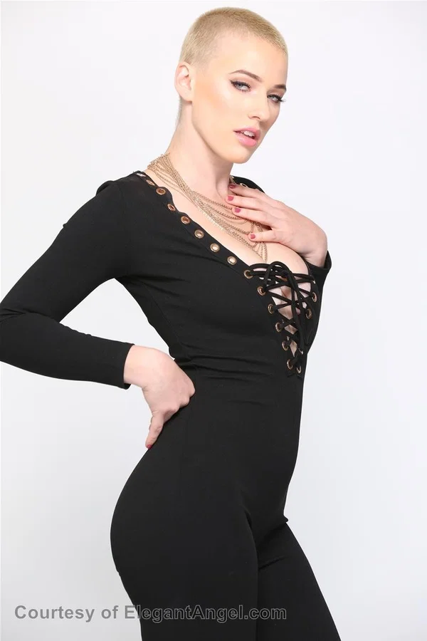 Blonde Riley Nixon poses in her tight black outfit & unveils her big tits  - Short Hair, Teen, Canadian, White, Natural Tits, Clothed, Pornstar, Big Tits, Beautiful, Blonde  - Photo 6