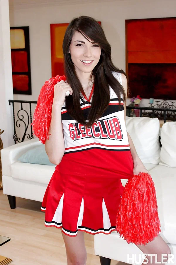 Naughty teen girl Emily Grey posing solo in sexy cheerleader uniform  - Cheerleader, Teen, Skinny, Pornstar, Socks, Babe, Ass, Clothed, Skirt, Upskirt  - Photo 1