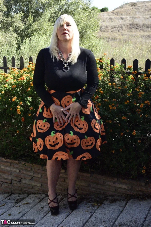 Mature blonde Melody exposes her bra and panties while dressed for Halloween  - Halloween, Mature, Clothed, Skirt, Outdoor, Ass, Upskirt, High Heels, PAWG, Amateur  - Photo 14