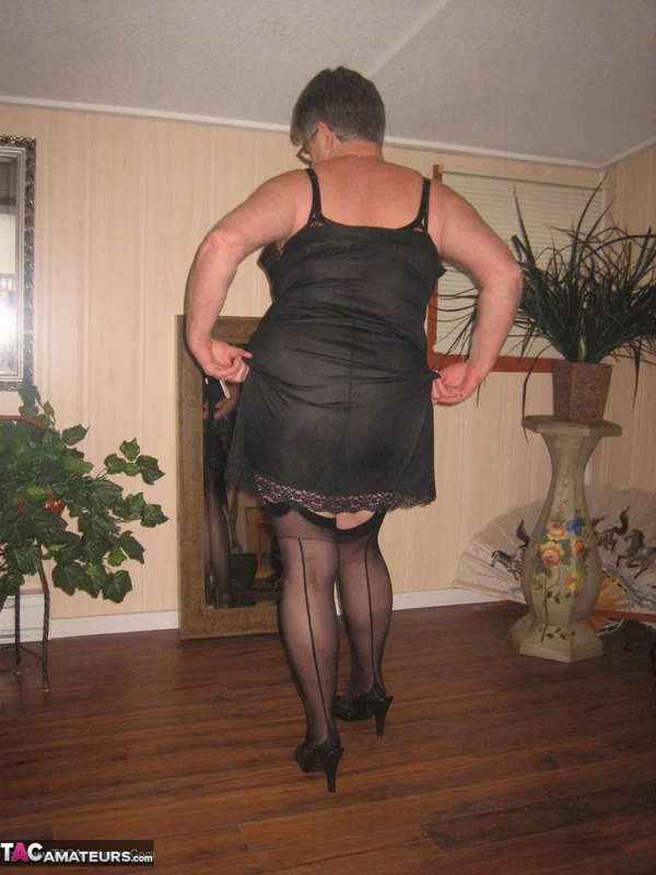Fat granny unleashes her huge breasts before flashing no panty upskirt  - Granny, BBW, High Heels, Glasses, Stockings, Lingerie, Amateur, Short Hair, Ass, Chubby  - Photo 10