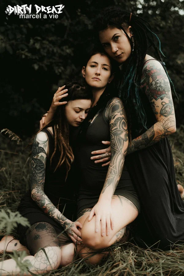 Three tattooed girls share lesbian kisses in long grass near a fir tree  - Tattoo, Humping, Threesome, Fetish, Lesbian, Ass, Ass Licking, Outdoor, Pigtails, Kissing  - Photo 3