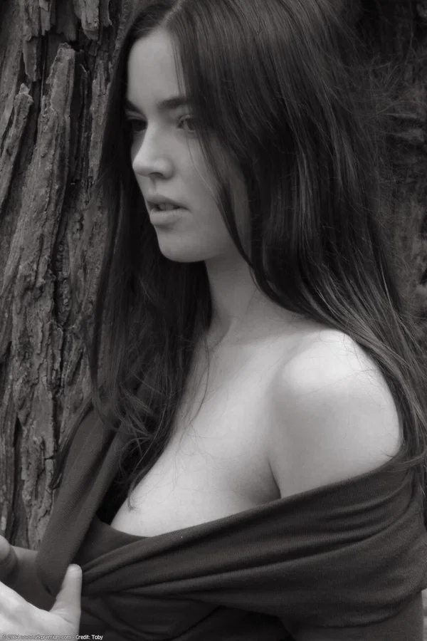 Young girl with long hair puts down her cowboy hat while getting naked near a tr  - Hairy, Outdoor, Beautiful, Babe, Skinny, Clothed, Teen, Amateur, Solo, Brunette  - Photo 3