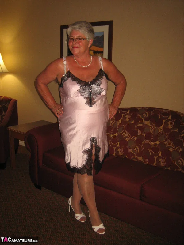Old amateur Girdle Goddess lets her boobs loose while on a chesterfield  - Granny, BBW, Glasses, Stockings, Chubby, Amateur, Short Hair, High Heels, Curvy, Skirt  - Photo 11