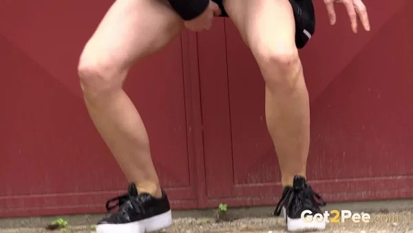 Blonde girl Nykla hitches up her dress before taking a piss by a garage  - Pissing, Pussy, Close Up, Panties, Shaved, Spreading, Outdoor, Skirt, Beautiful, Solo  - Photo 12