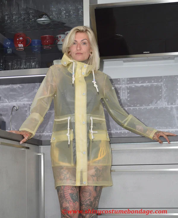 Tattooed blonde Miss Francine models barefoot in a raincoat over rubber wear  - Tattoo, Latex, Skirt, Fetish, Clothed, Kitchen, Shorts, Blonde, Non Nude  - Photo 12