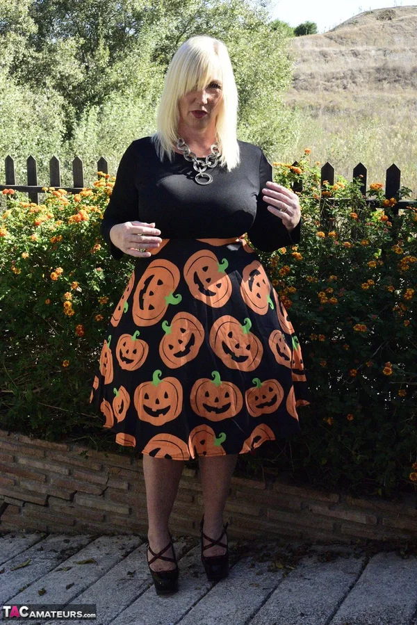 Mature blonde Melody exposes her bra and panties while dressed for Halloween  - Halloween, Mature, Clothed, Skirt, Outdoor, Ass, Upskirt, High Heels, PAWG, Amateur  - Photo 13