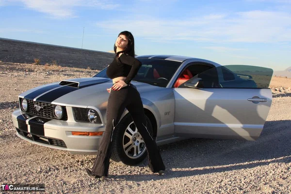 Brunette amateur Susy Rocks models by a muscle car during a safe for work gig  - Outdoor, Tall, Ass, Amateur, PAWG, Beautiful, Solo, Brunette, Non Nude  - Photo 7