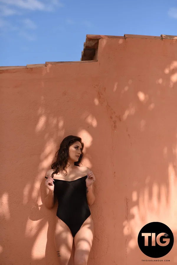 Gorgeous brunette Bonnie Lee doffs her bodysuit and shows off her fake boobs  - Bodysuit, Beautiful, Model, Solo, Outdoor, Ass, British, Big Tits, Natural Tits, PAWG  - Photo 10
