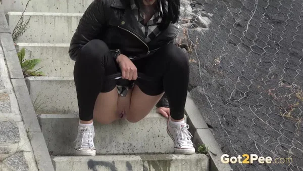 Dark haired girl Dee pulls down her leggings for a pee on concrete stairs  - Public, Pissing, Pussy, Glasses, Latina, Shaved, Leather, MILF, Spreading, Brunette  - Photo 7