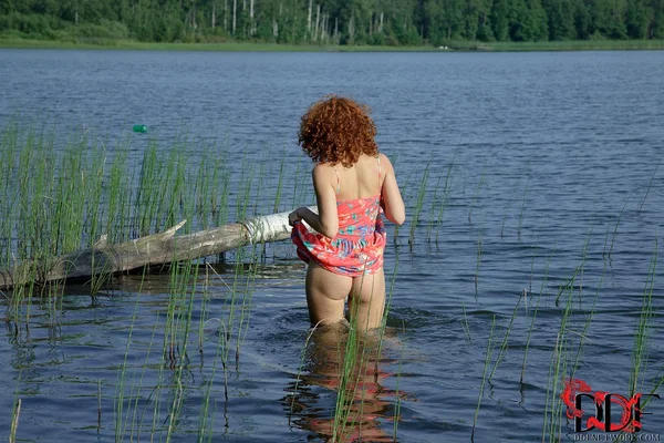 Solo girl Sunny exposes her perky little teen tits on a log in the water  - Teen, Outdoor, Redhead, Ass, Babe, Spreading, European, Wet, Cute, Undressing  - Photo 1