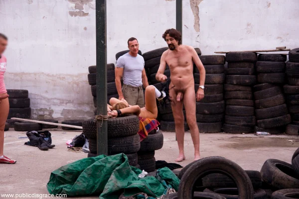 Jennifer Love is restrained in a tire before giving oral sex in public  - Bondage, Fetish, Public, Perfect, BDSM, Babe, Beautiful, Spreading, White, Blonde  - Photo 16