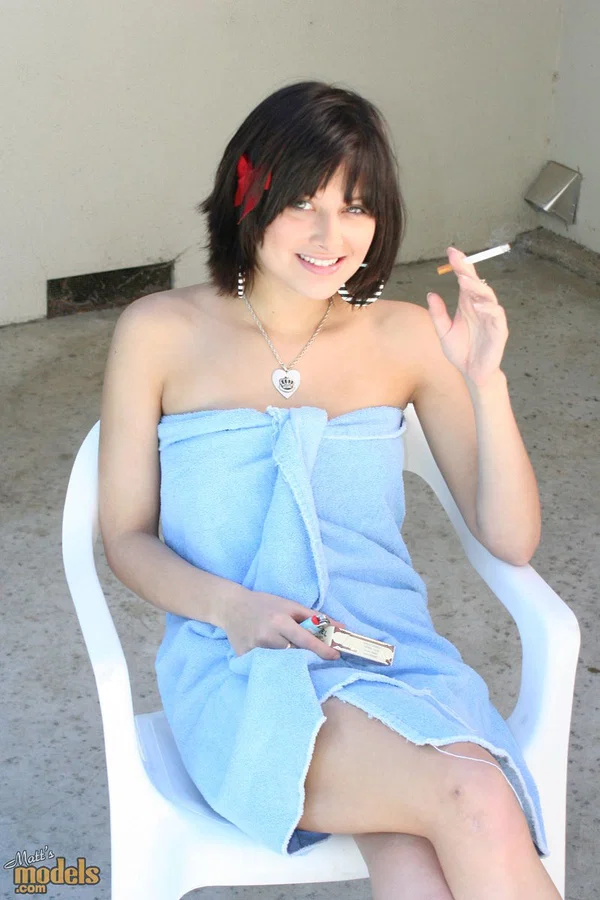 Brunette MILF Ellie Idol frees her naked body from bath towel while smoking  - Amateur, MILF, Face, Smoking, Outdoor, Brunette, Babe, Beautiful, Solo  - Photo 1