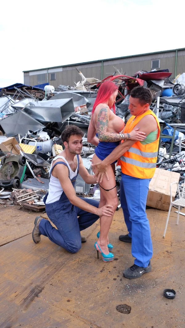 Redhead MILF with tattoos and fake tits gets banged in a junk yard 3some  - German, Blowbang, Gangbang, Tattoo, Ass, Groupsex, Upskirt, PAWG, Redhead, Cumshot  - Photo 9