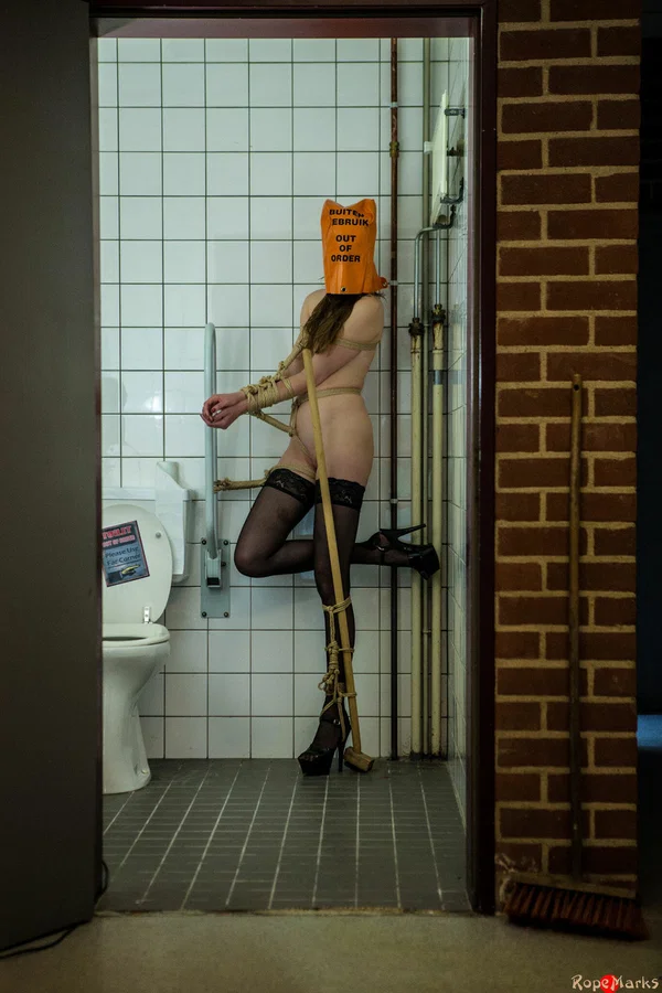 Caucasian female is tied up in a bathroom with a bag on her head  - BDSM, Bondage, High Heels, Stockings, Legs  - Photo 10