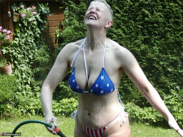 Mature woman Tiffany Pearl soaks herself with a hose while taking off a bikini  - Mature, Thick, Amateur, Bikini, Short Hair, Saggy Tits, BBW, Curvy, Chubby, Outdoor  - Photo 3