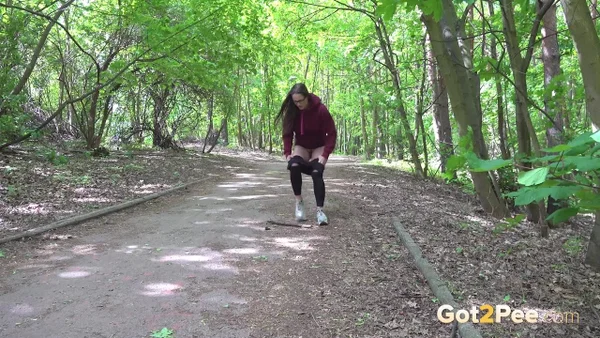 Barbe pulls down black leggings to pee on a roadway through the woods  - Pissing, Public, Pussy, Glasses, Hairy, Outdoor, Close Up, Spreading, Brunette, Undressing  - Photo 2