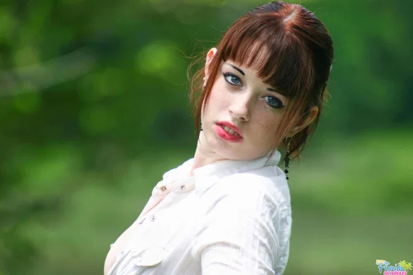 Amateur girl with red hair Barbie A exposes her tits while in a grassy field  - Amateur, Outdoor, Redhead, Clothed, Pigtails, Legs, Skirt, Big Tits, Upskirt, Tattoo  - Photo 1
