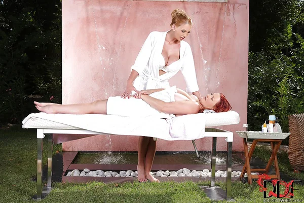 Busty mature masseuse has some lesbian fun with her juggy redhead client  - Mature, Lesbian, Pornstar, Big Tits, Nipples, Dildo, Redhead, Spreading, Outdoor, Feet  - Photo 1