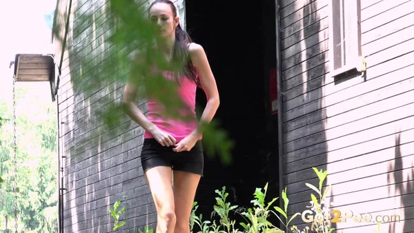 White girl Eveline Neill looks around while taking a pee in a lane  - Public, Pissing, Pussy, Spreading, Babe, Brunette, Shorts, Close Up, Hairy, Clothed  - Photo 1