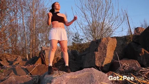 Brunette chick Violet Rilz takes a piss on a pile of rocks  - Pissing, Outdoor, Shorts, Close Up, Panties, Babe, Beautiful, Solo, Non Nude, Spreading  - Photo 14