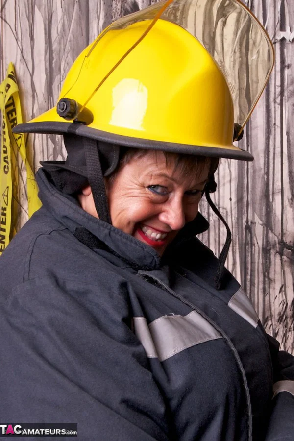 Mature fatty doffs her firefighter clothing to show her twat in stockings  - Mature, BBW, Amateur, Stockings, Brunette, Short Hair, Chubby, Uniform, European, Clothed  - Photo 9