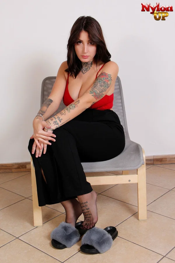 Busty brunette beauty Tokyo frees her pantyhose clad feet from slippers  - Feet, Tattoo, Piercing, Big Tits, Stockings, Spreading, Legs, Clothed, Solo, Babe  - Photo 1