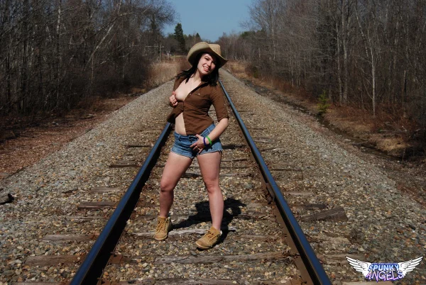 Young amateur Emily Love exposes herself on railway tracks in a hat and boots  - Outdoor, Beautiful, Amateur, Shorts, Spreading, Teen, Clothed, Cute, Babe, Solo  - Photo 2