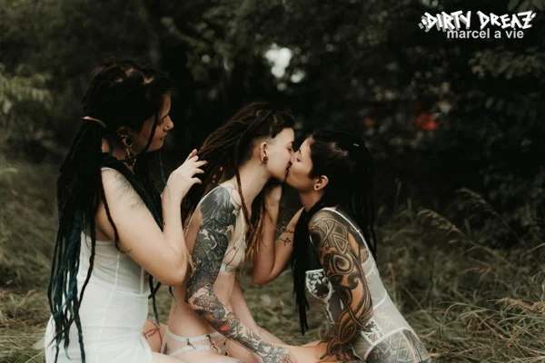 Three tattooed girls share lesbian kisses in long grass near a fir tree  - Tattoo, Humping, Threesome, Fetish, Lesbian, Ass, Ass Licking, Outdoor, Pigtails, Kissing  - Photo 10