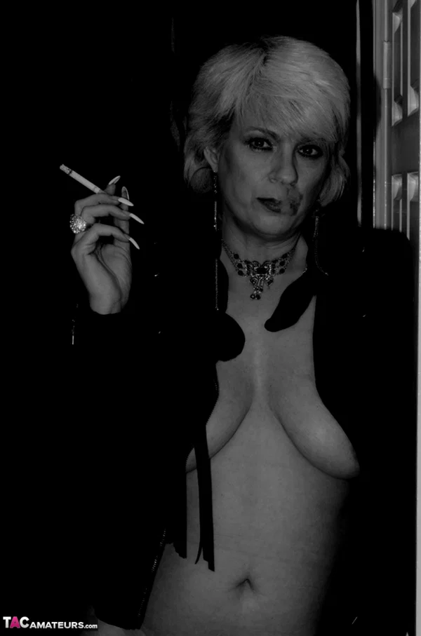 Older blonde lights a cigarette while showing her bare breasts and pussy  - Smoking, Mature, Saggy Tits, Short Hair, Amateur, Big Tits, Stockings, Hairy, Close Up, Spreading  - Photo 9