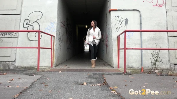 Brunette girl Eveline Neill gets caught pissing at a tunnel entrance in UGGs  - Public, Pissing, Pussy, Boots, Hairy, Spreading, Close Up, Brunette, Non Nude, Beautiful  - Photo 1