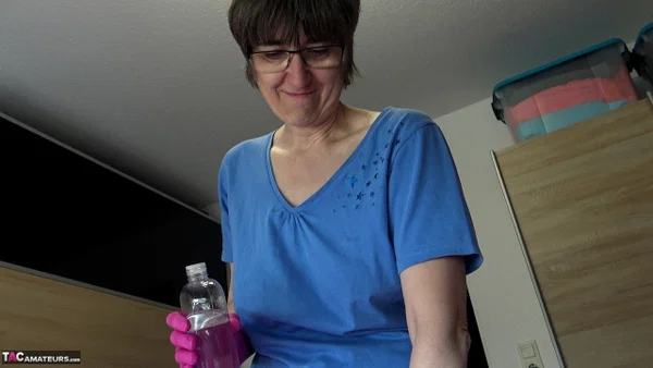 Amateur woman Hotmilf wears latex gloves while giving an oily handjob  - Latex, Mature, Oiled, Saggy Tits, Handjob, Big Cock, Short Hair, Upskirt, Close Up, Glasses  - Photo 1