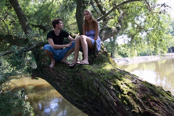 Young lovers have sexual intercourse on a tree limb over a body of water  - Pussy Licking, Amateur, Cute, Teen, Doggy Style, Outdoor, Ass Fucking, Reality, Skirt, Hardcore  - Photo 1