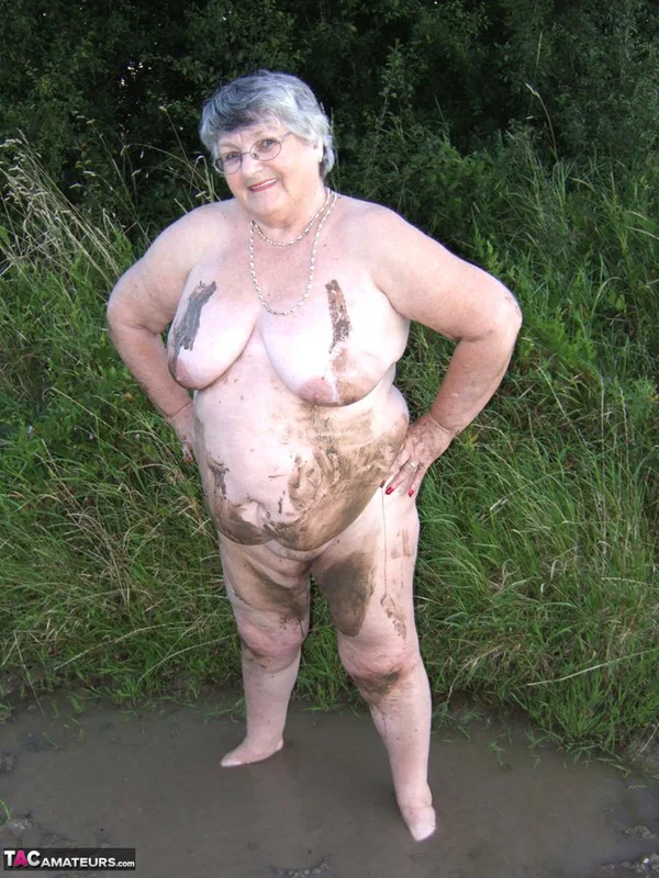 Fat nan Grandma Libby steps into a puddle before covering herself in mud  - Granny, BBW, Saggy Tits, Outdoor, Amateur, Chubby, Wet, Glasses, Curvy, Thick  - Photo 15
