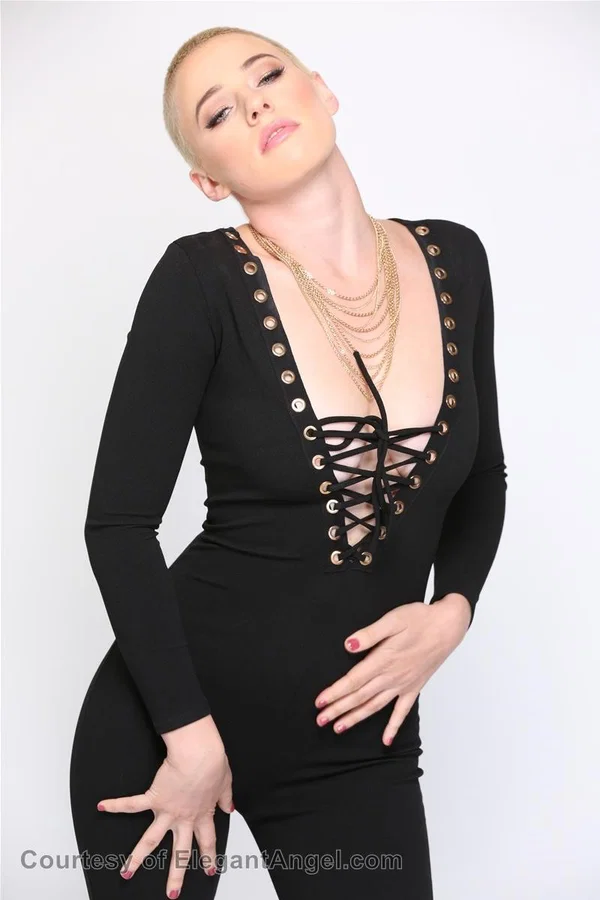 Blonde Riley Nixon poses in her tight black outfit & unveils her big tits  - Short Hair, Teen, Canadian, White, Natural Tits, Clothed, Pornstar, Big Tits, Beautiful, Blonde  - Photo 4